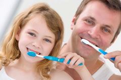 People brushing their teeth